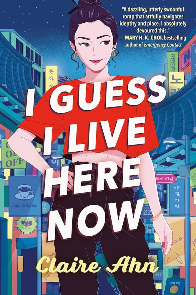 Book cover of 'I Guess I Live Here Now' by Claire Ahn with a stylized cityscape background.