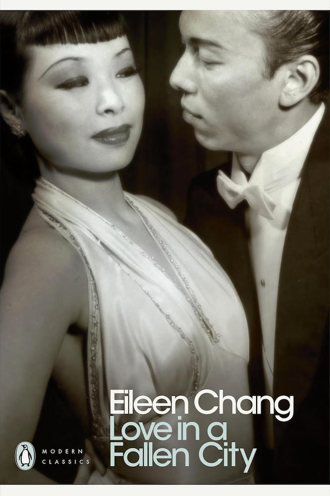 Book cover of 'Love in a Fallen City' by Eileen Chang featuring a black and white photo of a couple.