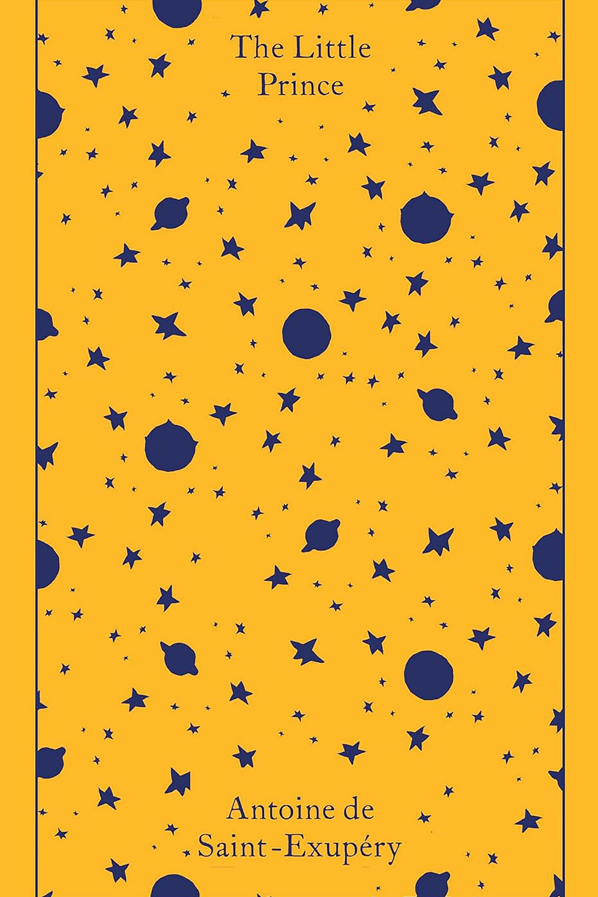 Book cover of 'The Little Prince' with a pattern of blue stars and planets on a yellow background.