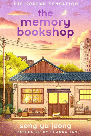 Book cover of 'The Memory Bookshop' with a house and sunset illustration.
